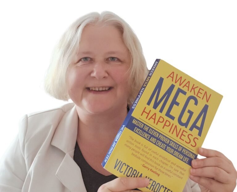 Victoria Herocten with the book Awaken Mega Happiness